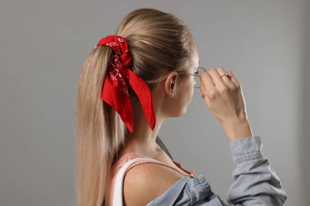 istock Woman with stylish red bandana on light grey background 1452870690