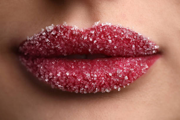 istock Young woman with beautiful lips covered in sugar, closeup 1452870724