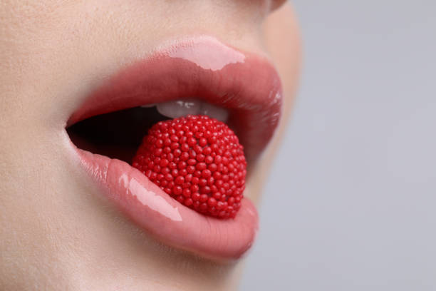istock Young woman with perfect lips makeup, closeup 1452870754