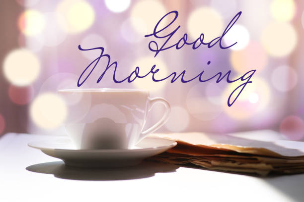 istock Delicious coffee and newspaper on table against blurred background. Good morning 1452873465