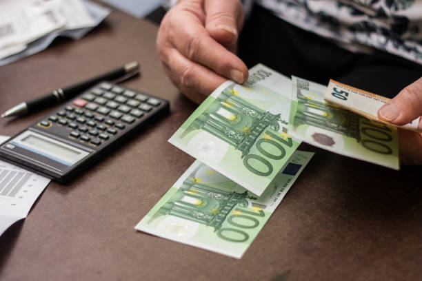 istock Senior woman checking her bills at home 1452873476