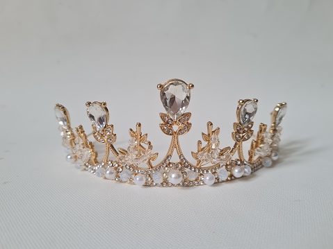 The crown is decorated with diamonds and pearls that look beautiful.