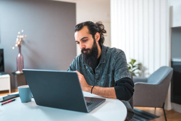 istock Attractive Mixed Race Male Working In An Online Meeting 1452876412