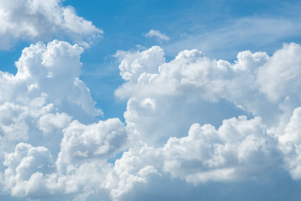 istock White fluffy clouds on blue sky. Soft touch feeling like cotton. White puffy cloudscape. Beauty in nature. Close-up white cumulus clouds texture background. Sky on sunny day. Pure white clouds. 1452877197