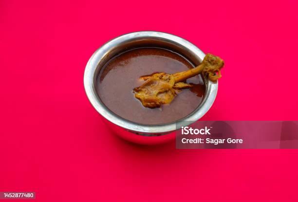 Indian Chicken Curry In A Bowl With An Isolated Red Background Stock Photo - Download Image Now