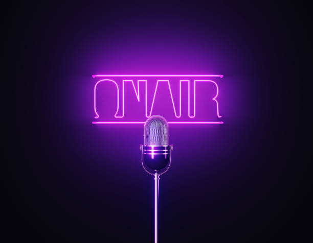 istock Purple Neon Light Writes On Air Above A Silver Colored Microphone Over Black Background 1452877640