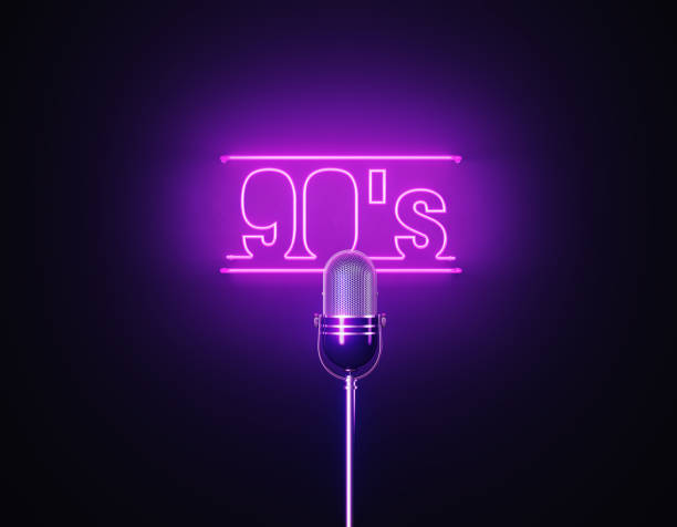 istock Purple Neon Light Writes 90's Above A Silver Colored Microphone Over Black Background 1452877659