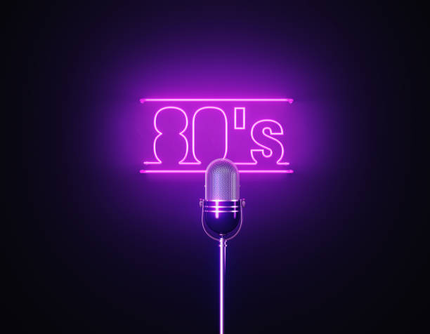 istock Purple Neon Light Writes 80's Above A Silver Colored Microphone Over Black Background 1452877715
