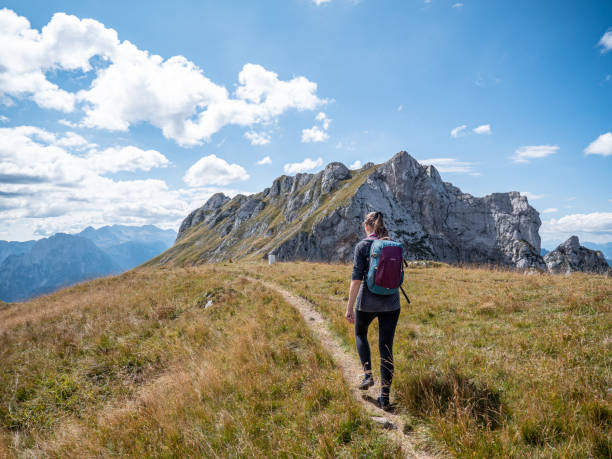 istock A woman walking among the mountains. 1452878364
