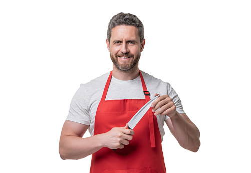 chef in red apron hold knife isolated on white background.