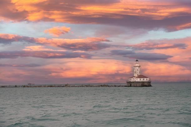 istock Scenic cloudy sunset at a coast with a lighthouse 1452885383