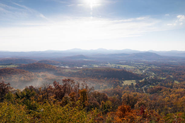 Photo of Scenic overlook of mountains with bright sun burning off ground fog, eastern USA