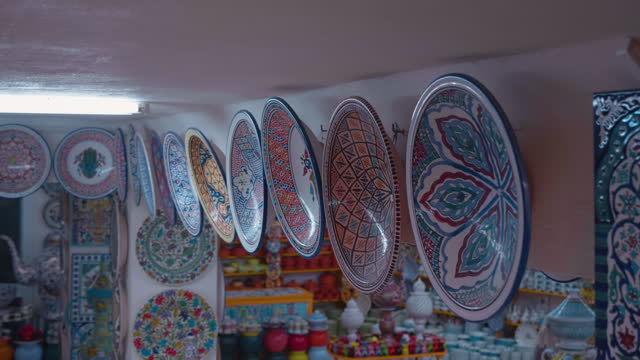 Ceramic souvenir plates for walls decoration in crafts market.