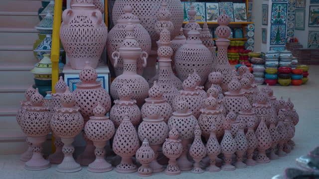 Pile of authentic clay crafts ceramic of unpanited jars tagine.