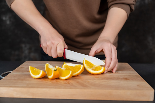 A family woman was cutting fruit