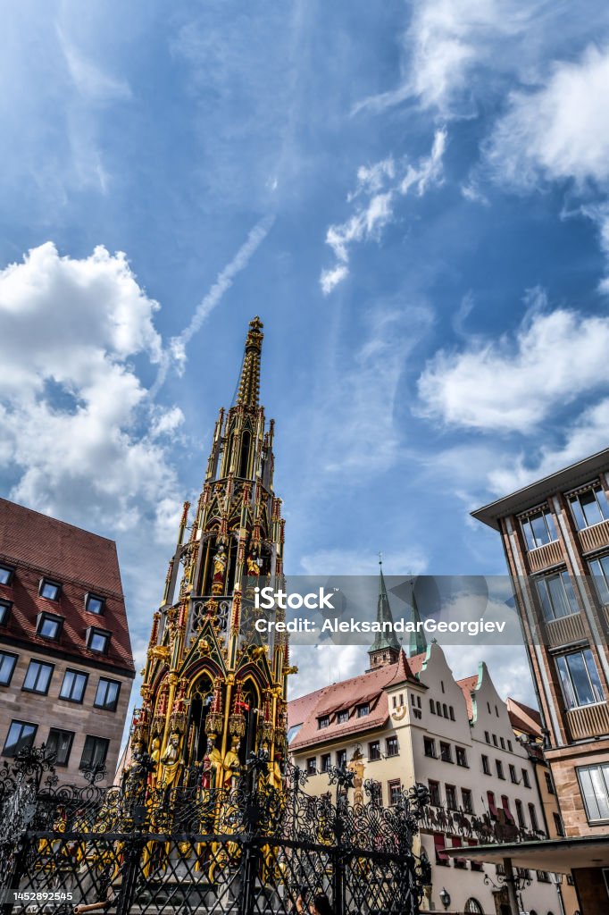 Low Angle View Of Schoner Brunnen In Nuremberg, Germany Ancient Stock Photo