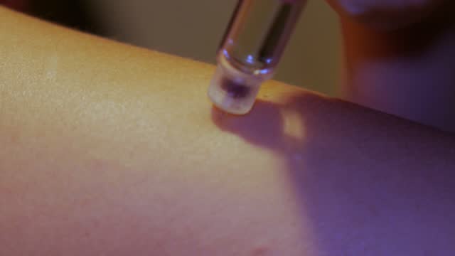 young woman makes insulin injection on arm, diabetes preventio