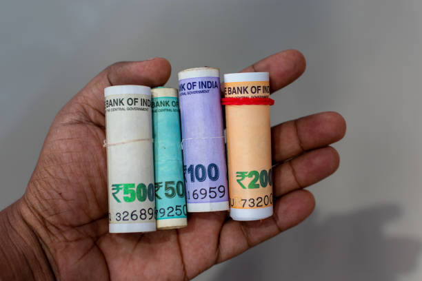 istock Indian paper currency or money roll using new rupees 500, 200, 100 and 50 notes. 1452895064