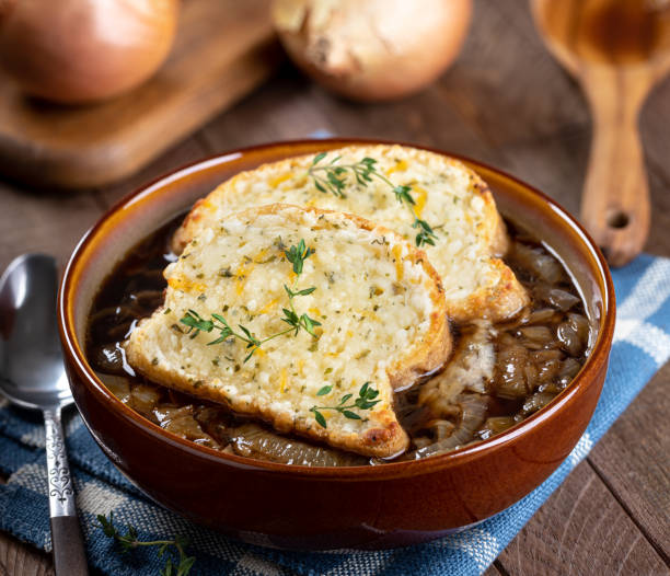 istock French onion soup with toasted cheese baguette garnished with thyme 1452895201