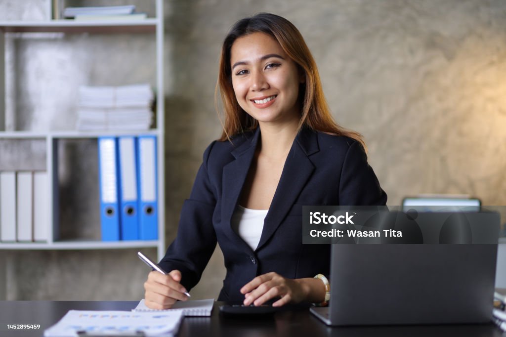 Portrait of a charming business woman in the office. Secretary Stock Photo