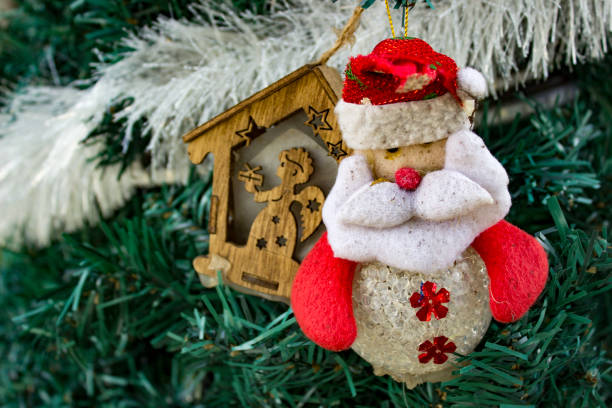 Christmas tree decorations with Santa Claus doll and wooden ornament