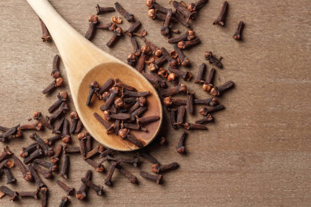 istock Whole Cloves And Wooden Spoon 1452896658