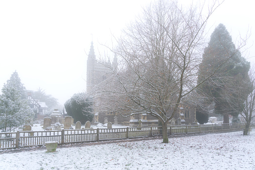A wintery scene in Beaconsfield as snow falls on the church in the Old Town