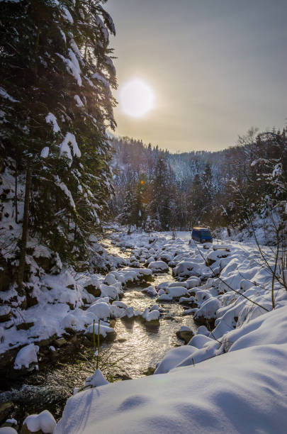 istock Beautiful winter landscape with river and snow on the trees 1452898778