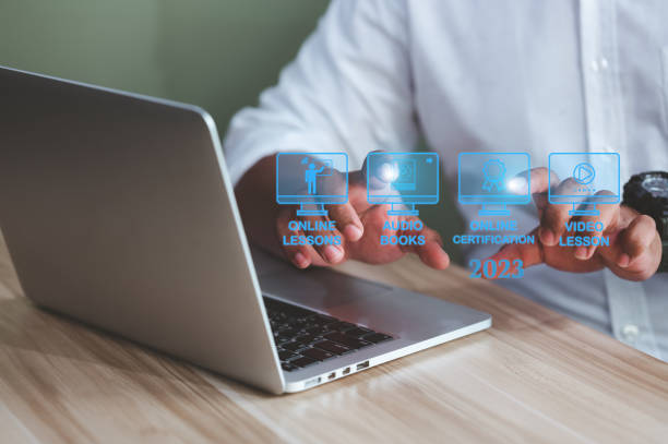 istock Black businessman using computer and new technology, internet education, online course, online learning concept in 2023 1452898889