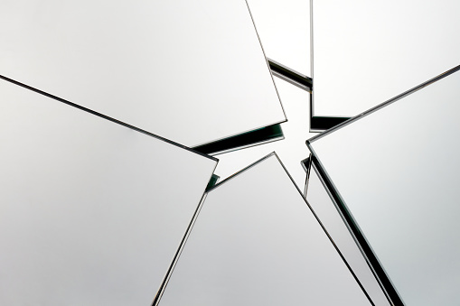 Abstract glass background. Polygonal surface. Close-up.