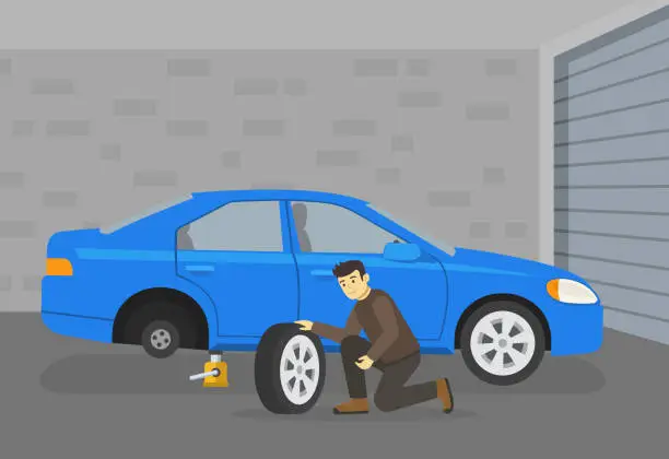 Vector illustration of Young male character sits down and changes the flat rear tire in his garage. Side view.