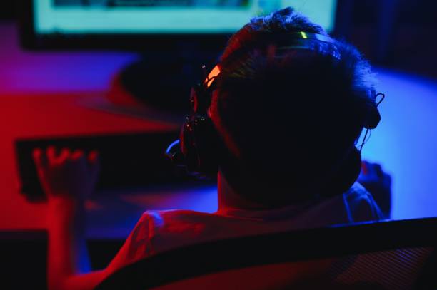 istock Boy in the headphones is playing a game. 1452900916
