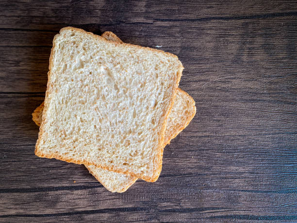istock Wheat bread ready to eat on the wooden background 1452903507