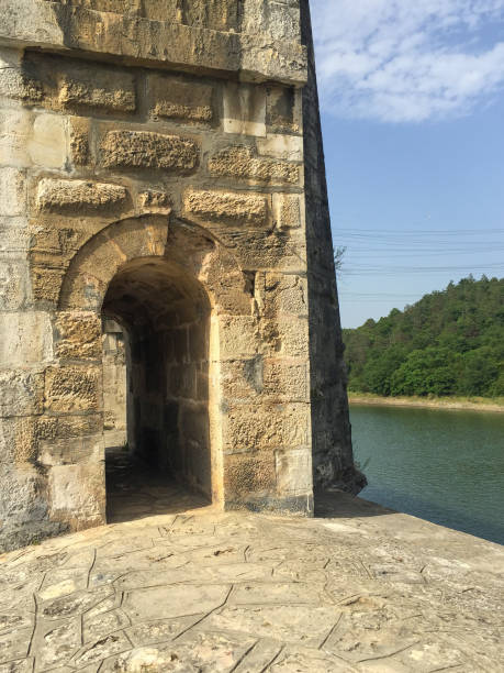 istock Aqueduct door with lake and forest background 1452903645