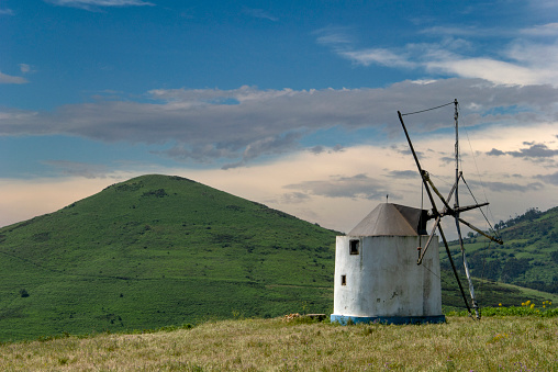 White historic windmill in Portugal.