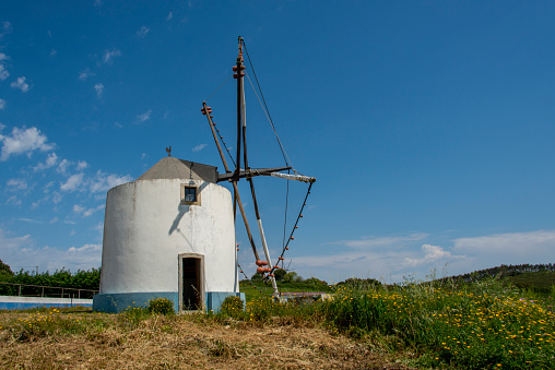 White historic windmill in the Mafra region, Portugal.