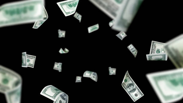 istock Money stack. Hundred dollars of America. Falling money isolated, us bill black background. 1452905480