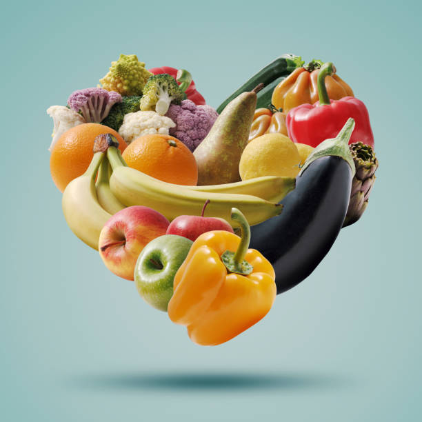 istock Fruits and vegetables arranged in a heart shape 1452906713