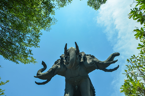Giant three headed bronze elephant at temple in Bangkok, Thailand.
