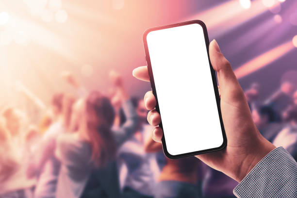 istock Woman holding a smartphone at the disco 1452907045