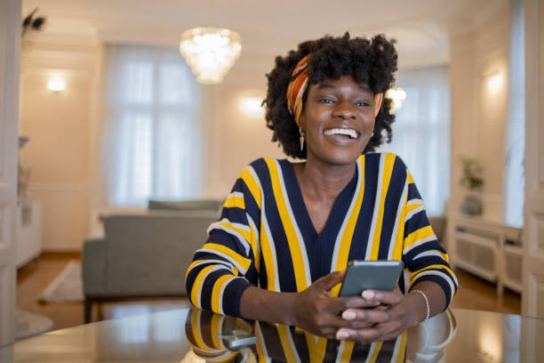 istock Happy young woman using phone 1452908232