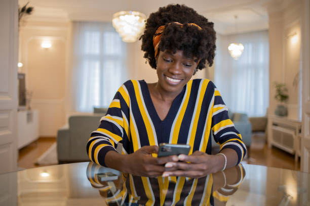 istock Happy young woman using phone 1452908237