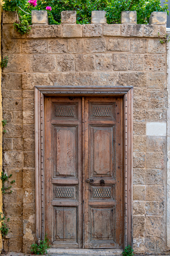 A door in a garden wall in the old town of Tyre in Lebanon