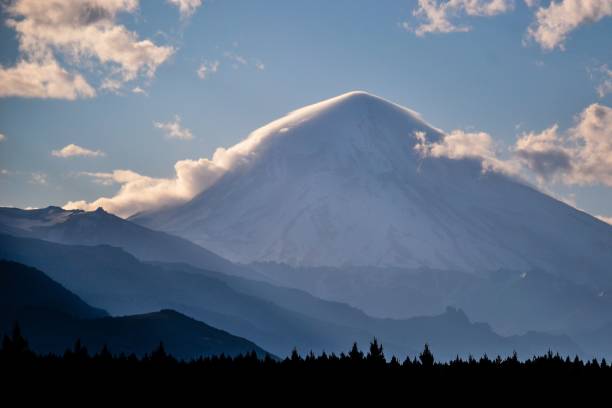 istock Beautiful landscape displaying the ice-clad, cone shaped Lanin stratovolcano surrounded by clouds 1452912247