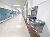 Drinking fountain in school corridor