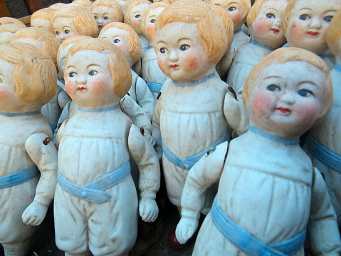 Antique porcelain baby dolls in a flea market