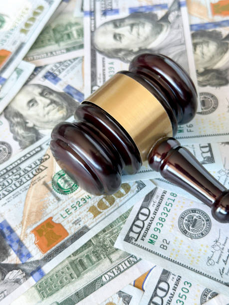 istock Judge gavel and dollar roll 1452913828