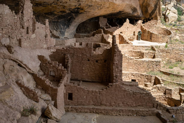 istock Long House Cliff Dwelling with rangers waiting to interpret 1452913836