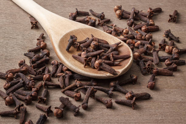 istock Whole Cloves And Wooden Spoon 1452913882