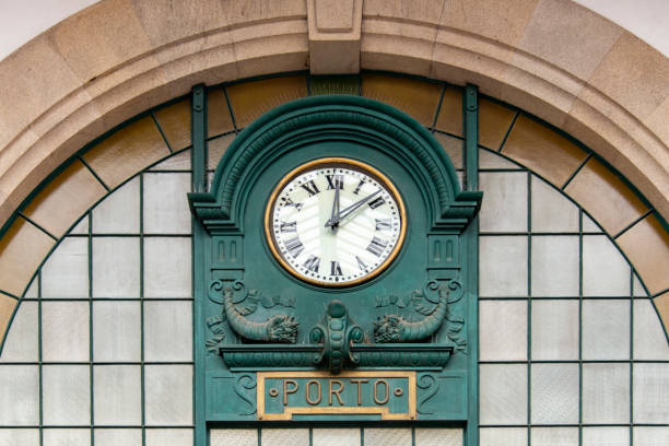 Clock and leaded window in the São Bento railway station in Porto.